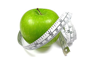 Image of an apple with a tape measure around it
