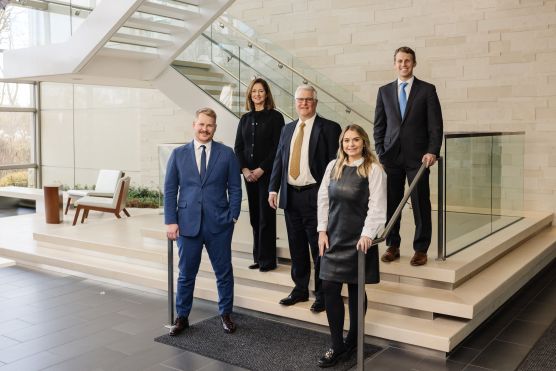 Frank Holsteen (middle) and Wespath colleagues