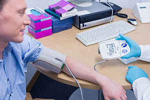 person getting their blood pressure measured