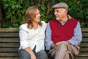 people talking on a bench