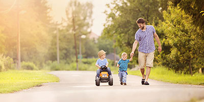 man wlaking with toddlers