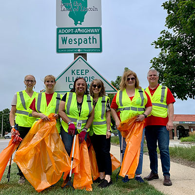 Wespath Employees cleaning a road