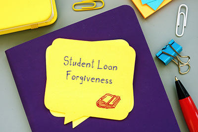 photo of student loan forgiveness written on a notebook
