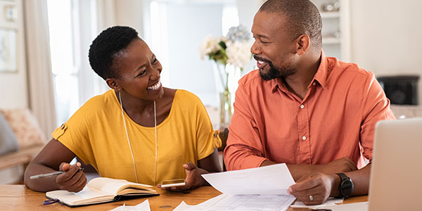 photo of a couple reviewing their finances