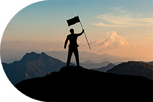 photo of man atop a mountain