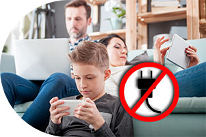 photo of children and adults on digital devices