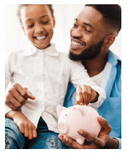 photo man holding his son and a piggy bank