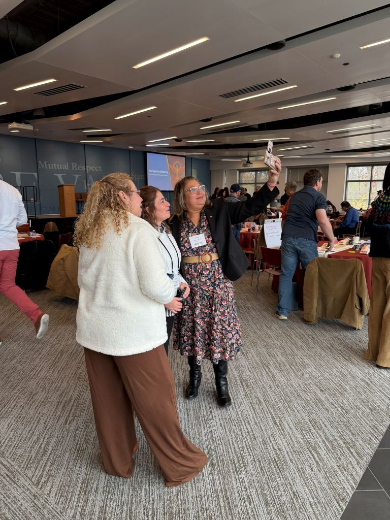 Attendees connecting and grabbing selfies with one another