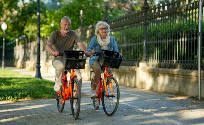 Elderly couple biking