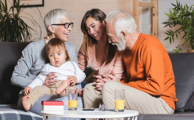 Family relaxing at home with three generations
