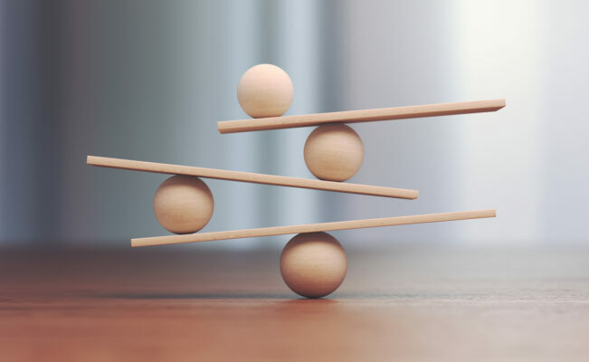 Wooden balls balancing on one another