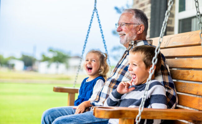 Fun story time with grandpa on the porch swing