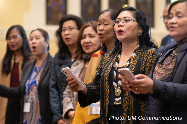 Seven women are standing next to each other.